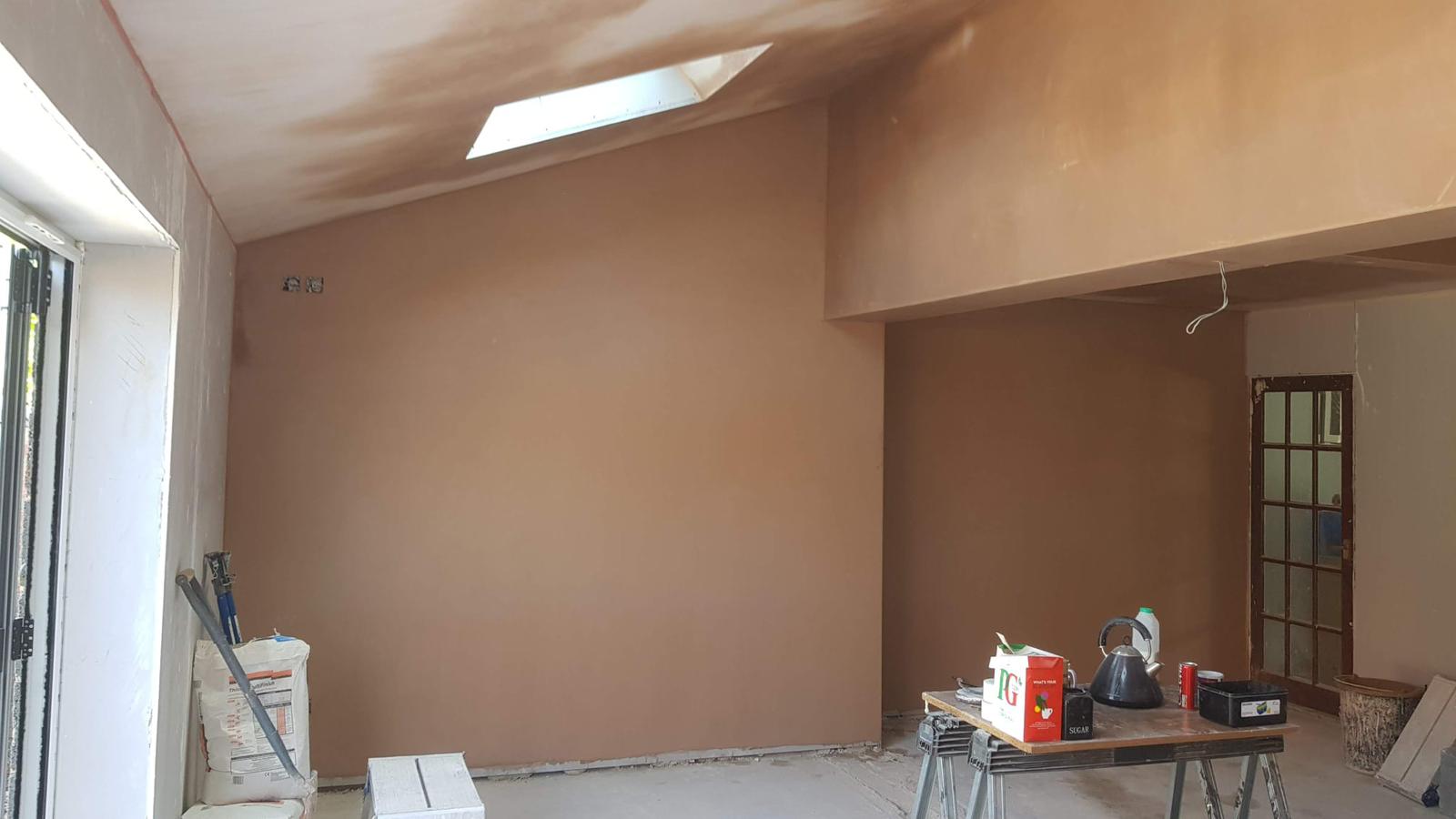 Kitchen extension freshly plastered walls and ceiling with skylight