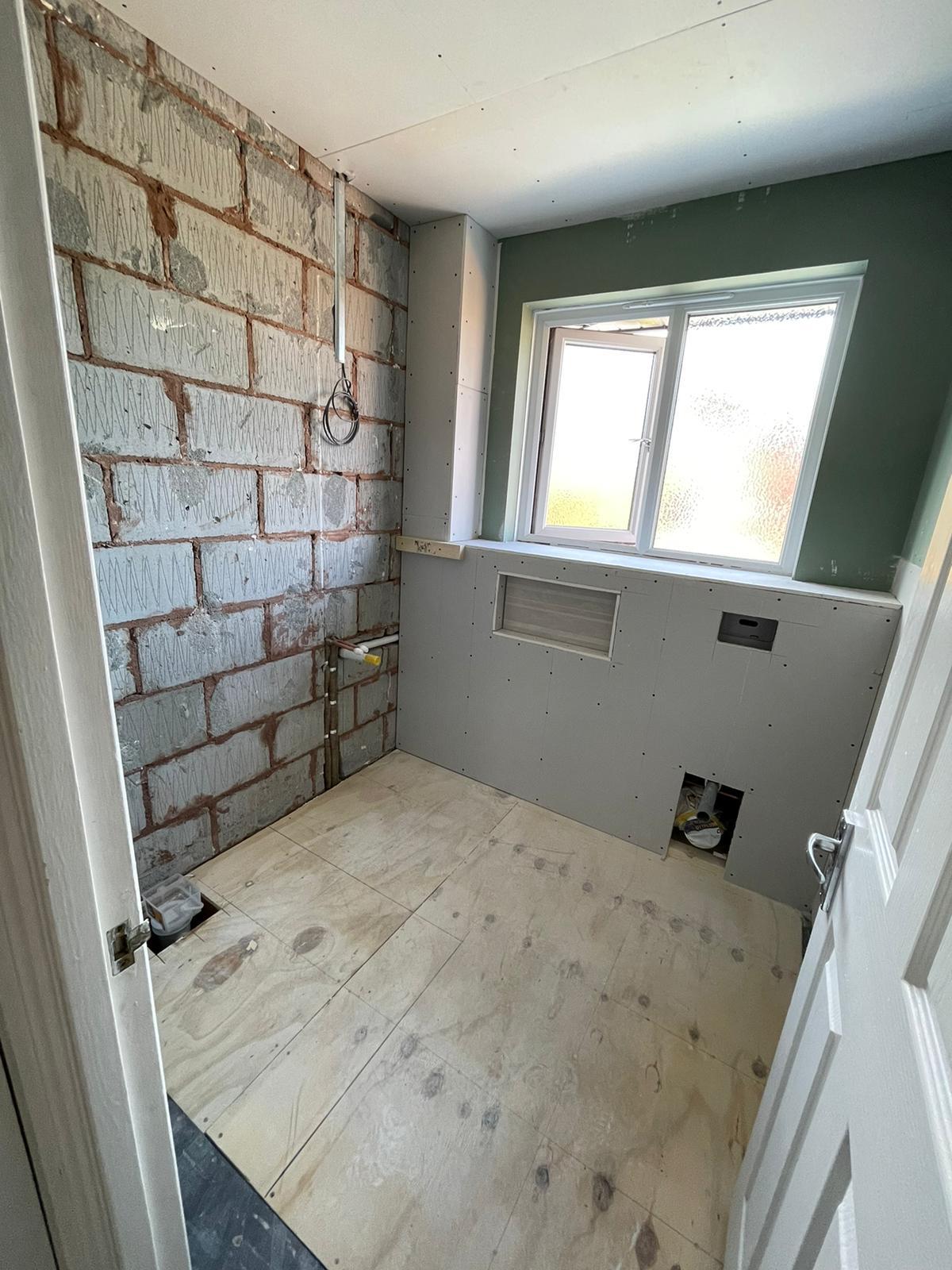 Bathroom boarding with blockwork wall and plasterboard