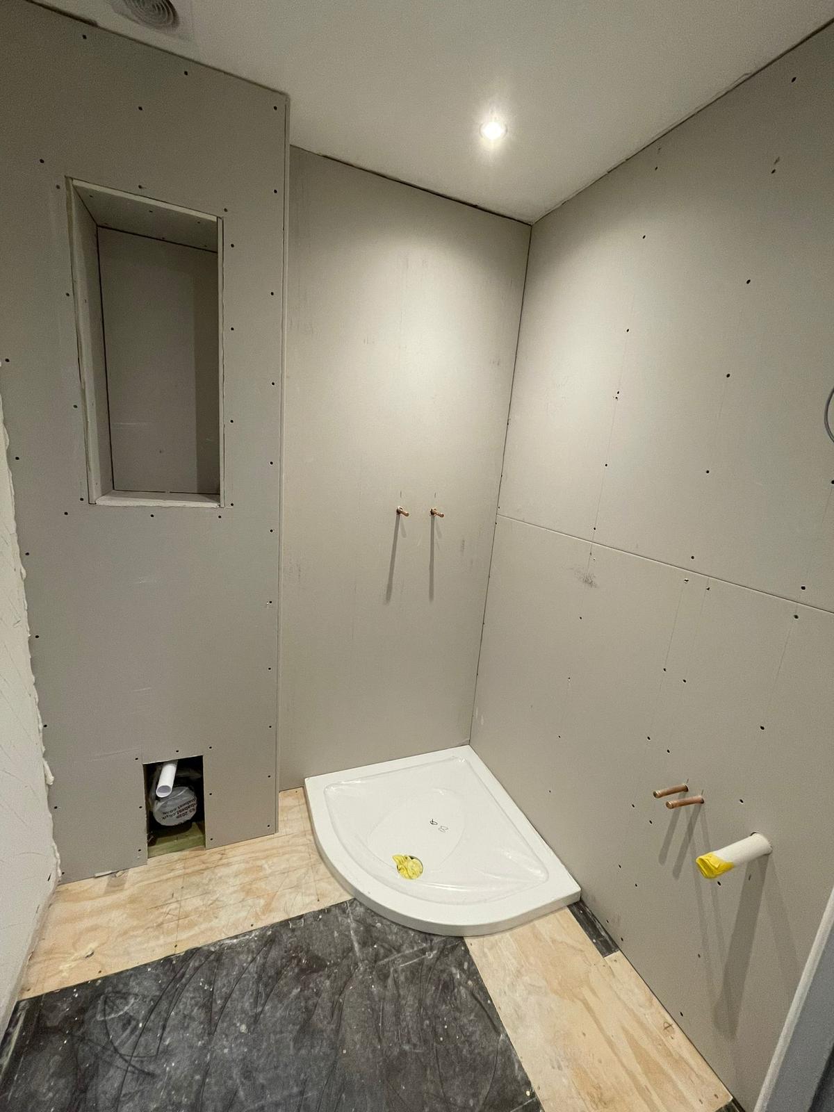 Shower room boarding with recessed niche and shower tray fitted
