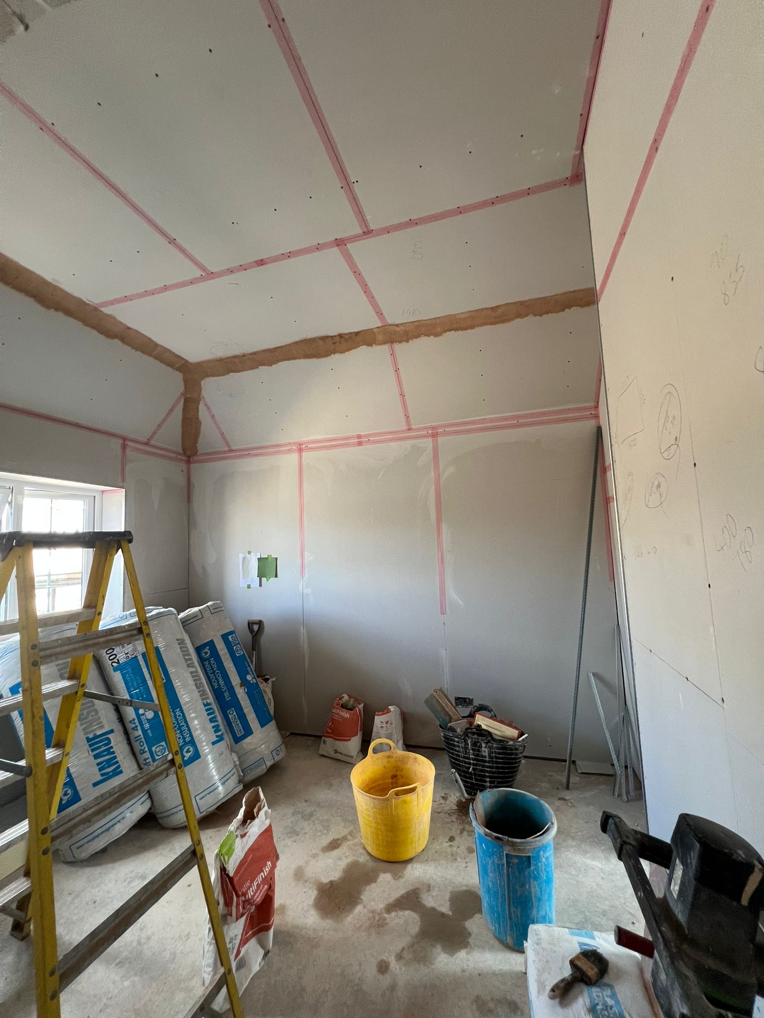 Loft conversion boarding from another angle with insulation rolls