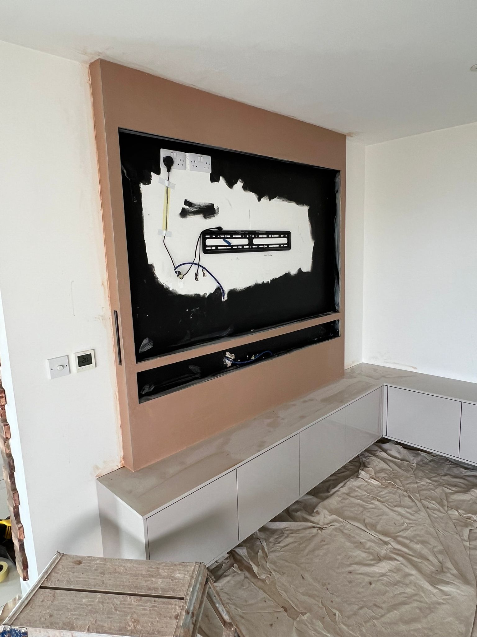 Media wall with TV recess freshly plastered