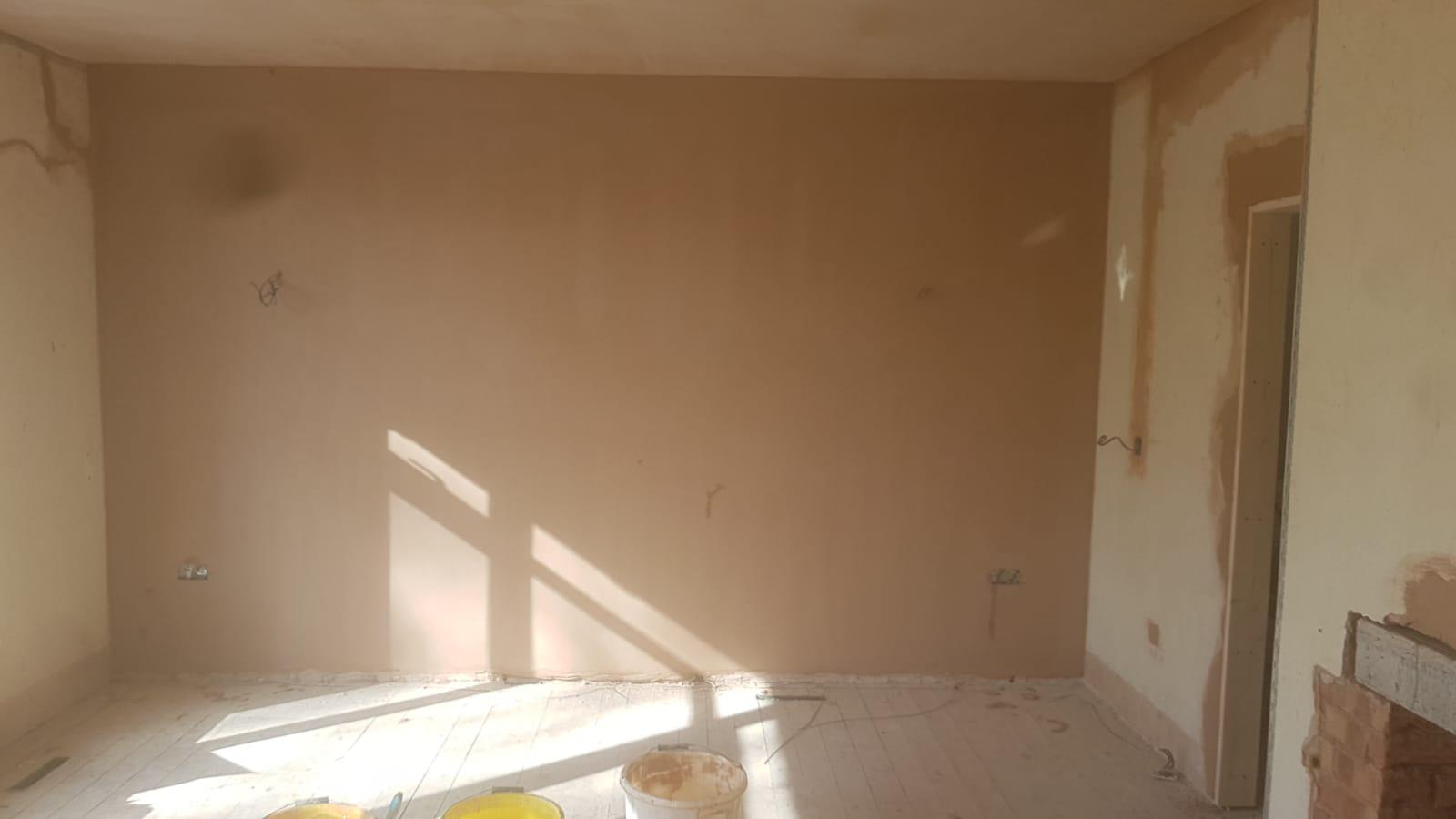 Large wall freshly skimmed with natural sunlight