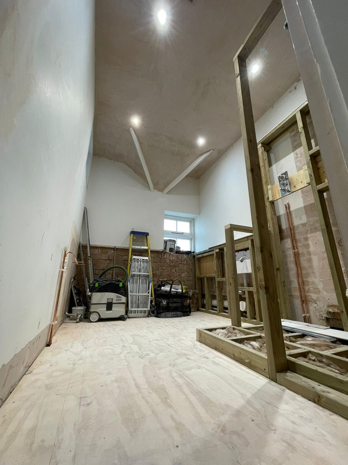 Barn conversion with vaulted ceiling, downlights and timber frame
