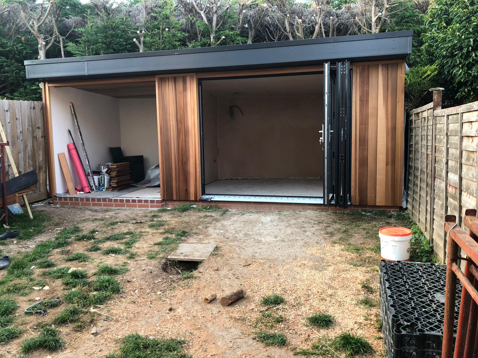 Garden room with cedar cladding and bifold doors